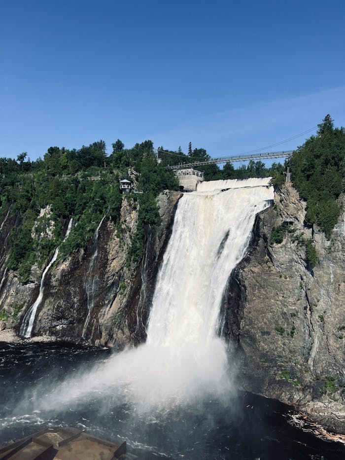 Experience the breathtaking Montmorency Falls with vibrant scenery in Quebec, Canada.