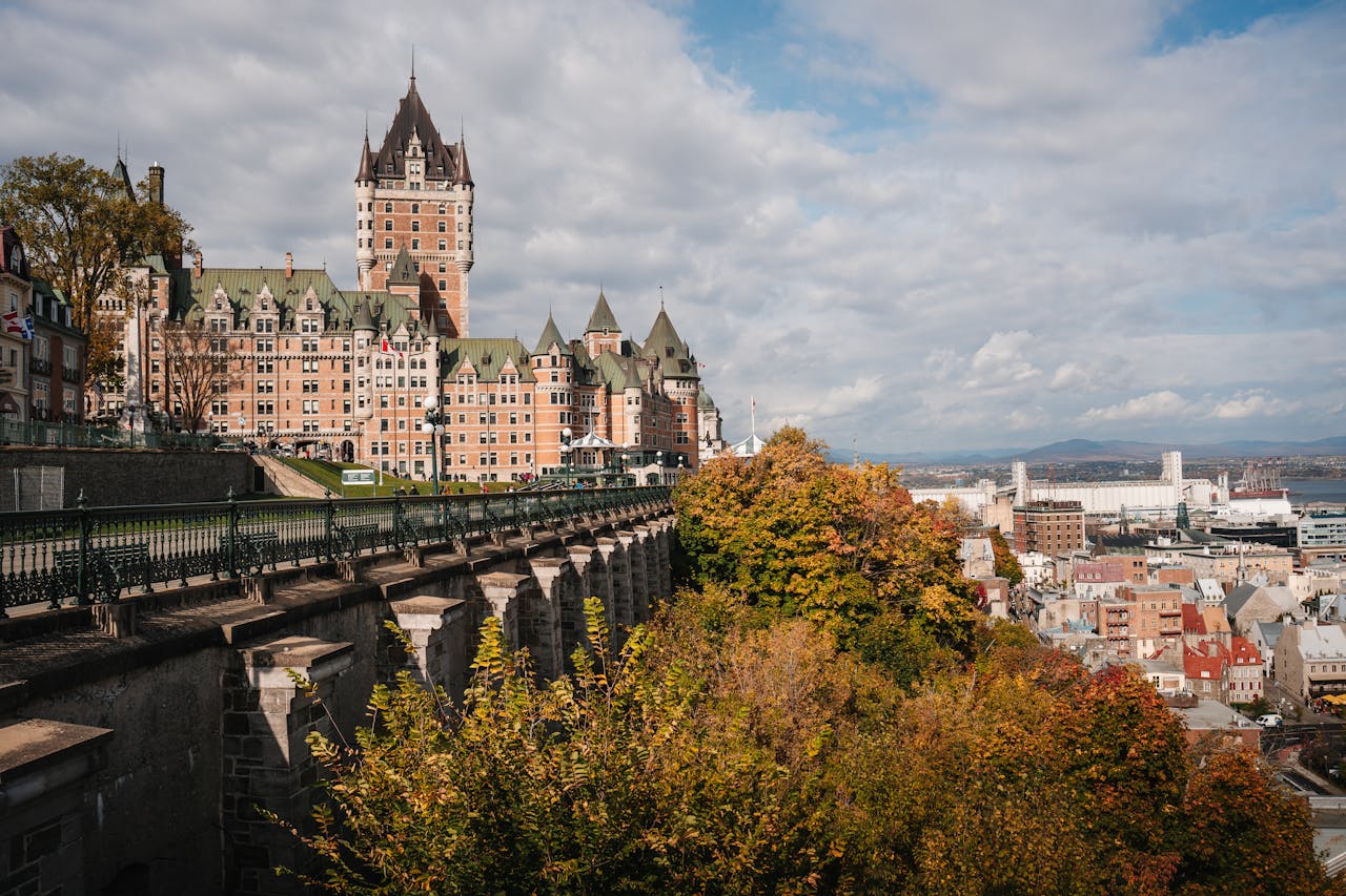 Château Frontenac with vibrant fall foliage in Québec City, Canada.