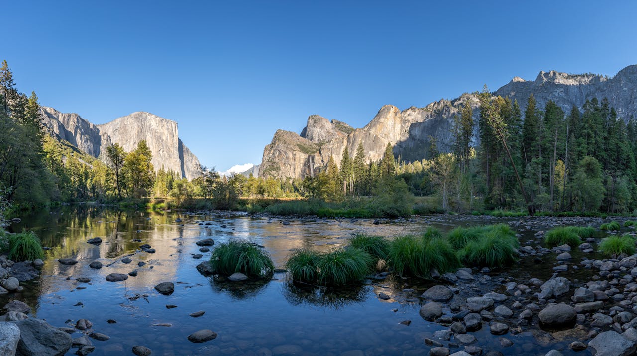 Stunning summer landscape of Yosemite Valley with El Capitan and the Merced River.